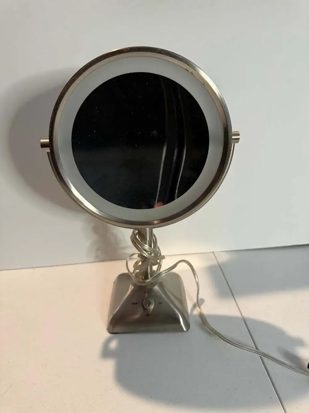 Oval Shaped Double-Sided Lighted Makeup Mirror with Adjustable Settings